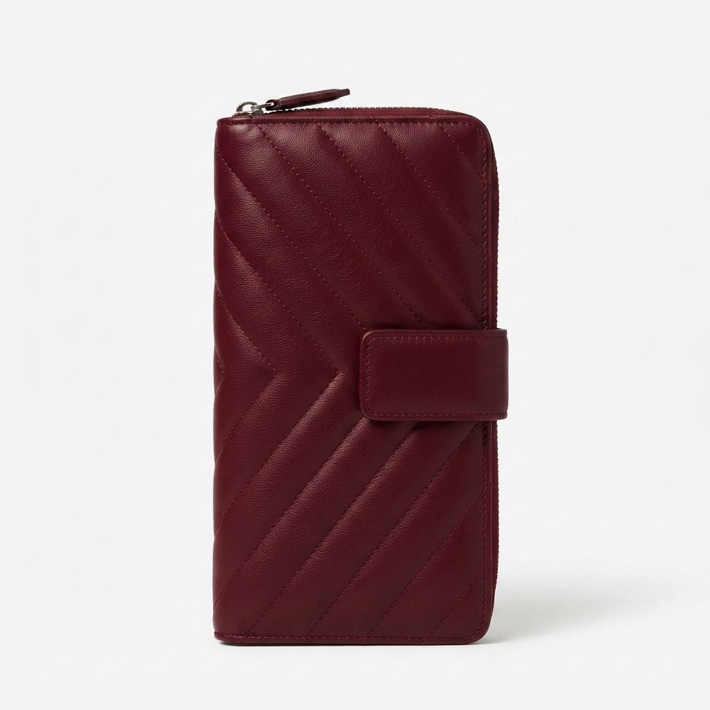 A burgundy quilted zip-around lambskin wallet