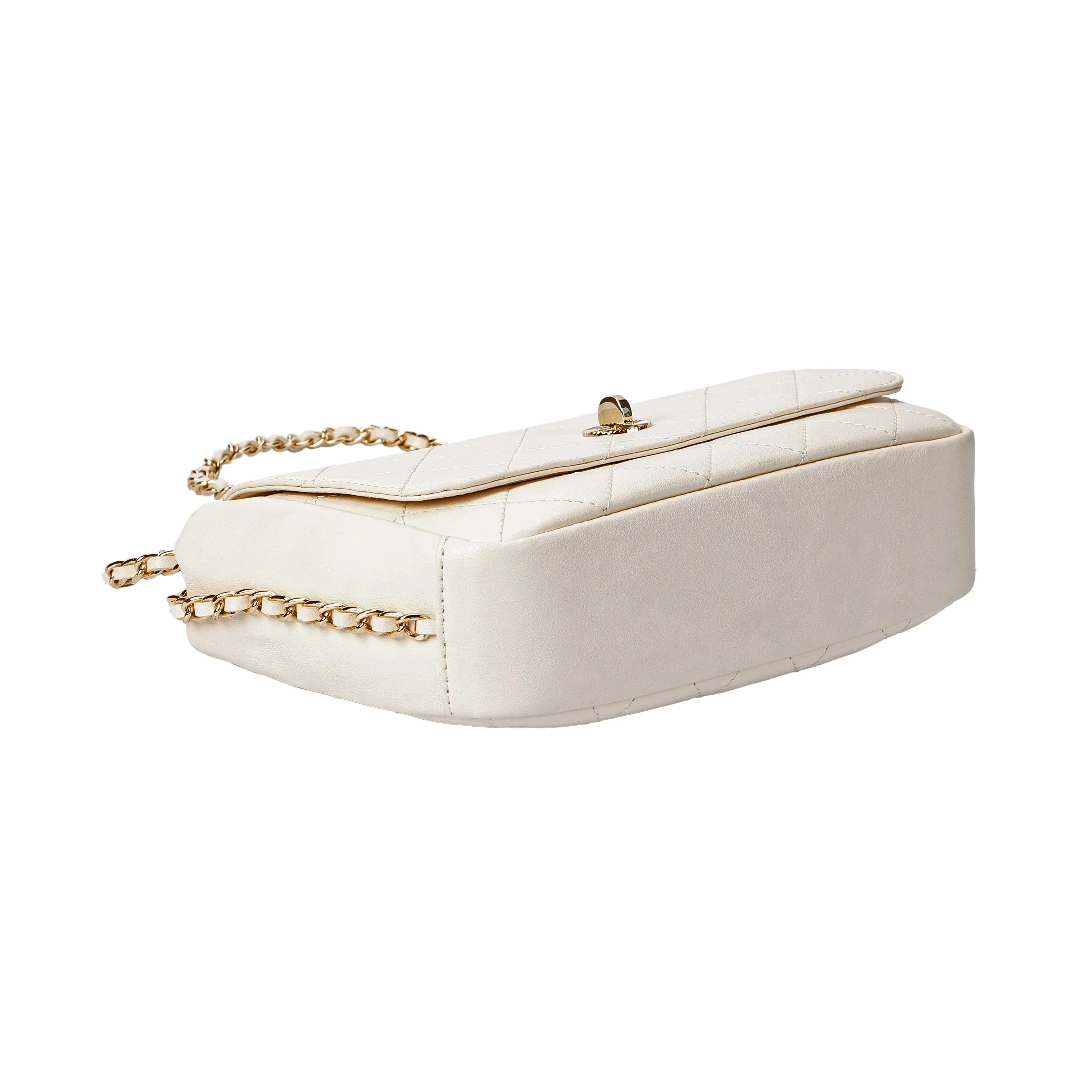 Bottom view of ivory quilted leather crossbody bag with structured base
