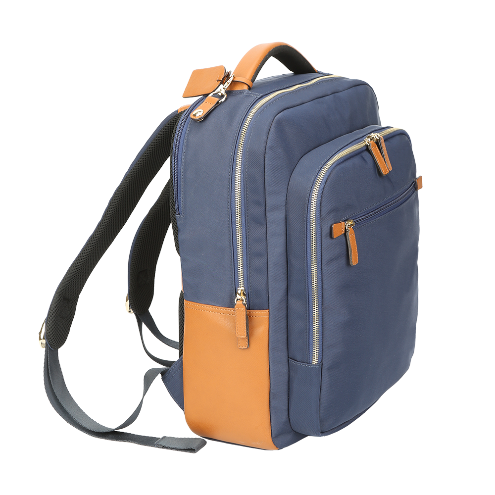 Side view of men’s navy nylon and leather backpack with adjustable straps.