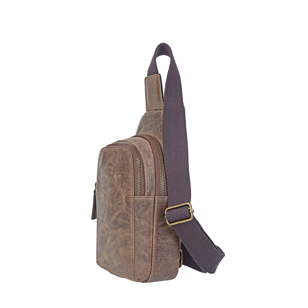 Side view of men’s small distressed leather crossbody bag