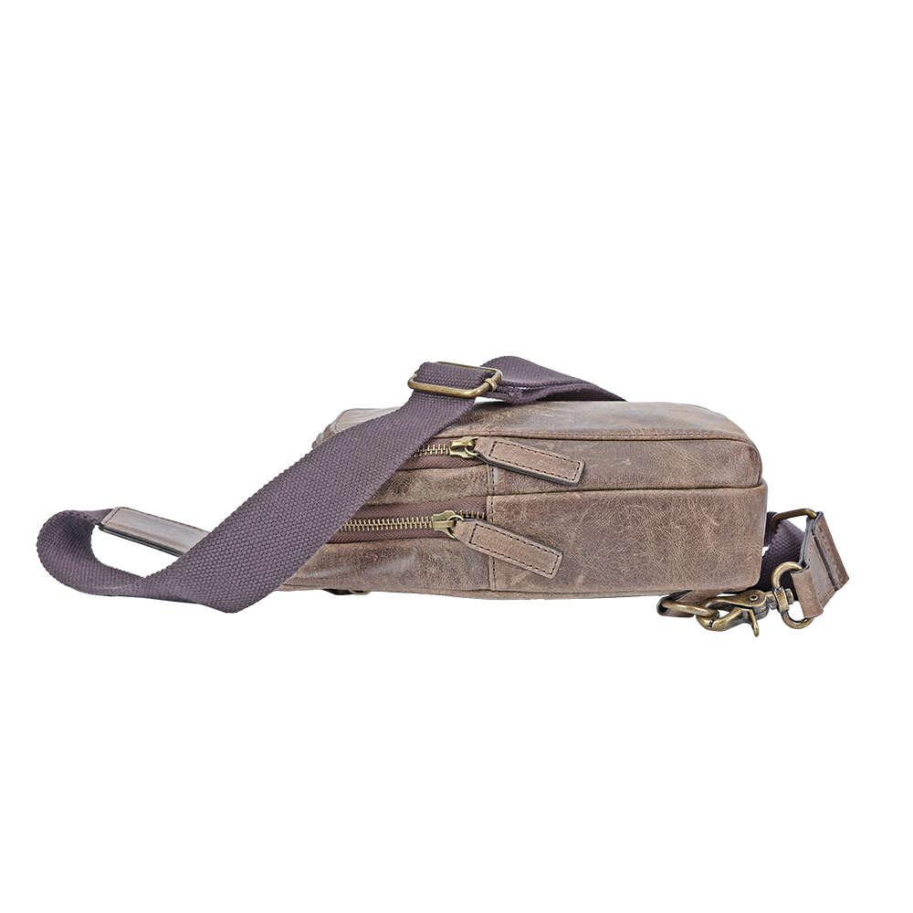 Side view of men’s small distressed leather crossbody bag