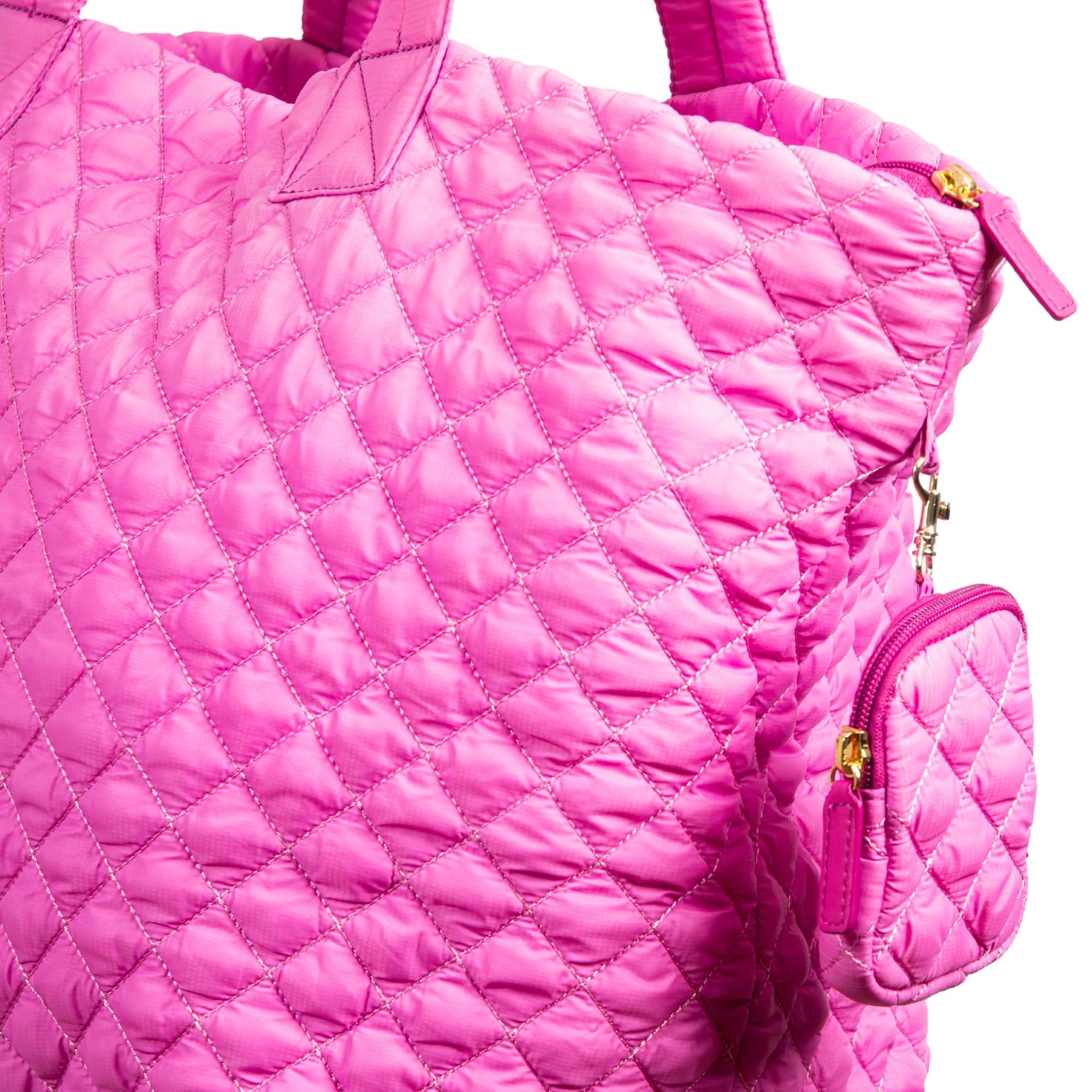 Close-up of pink quilted nylon tote bag with detachable mini pouch