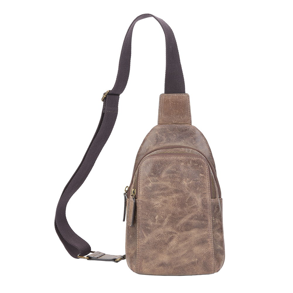 Front view of small brown Crazy Horse leather sling bag with two top zippers.