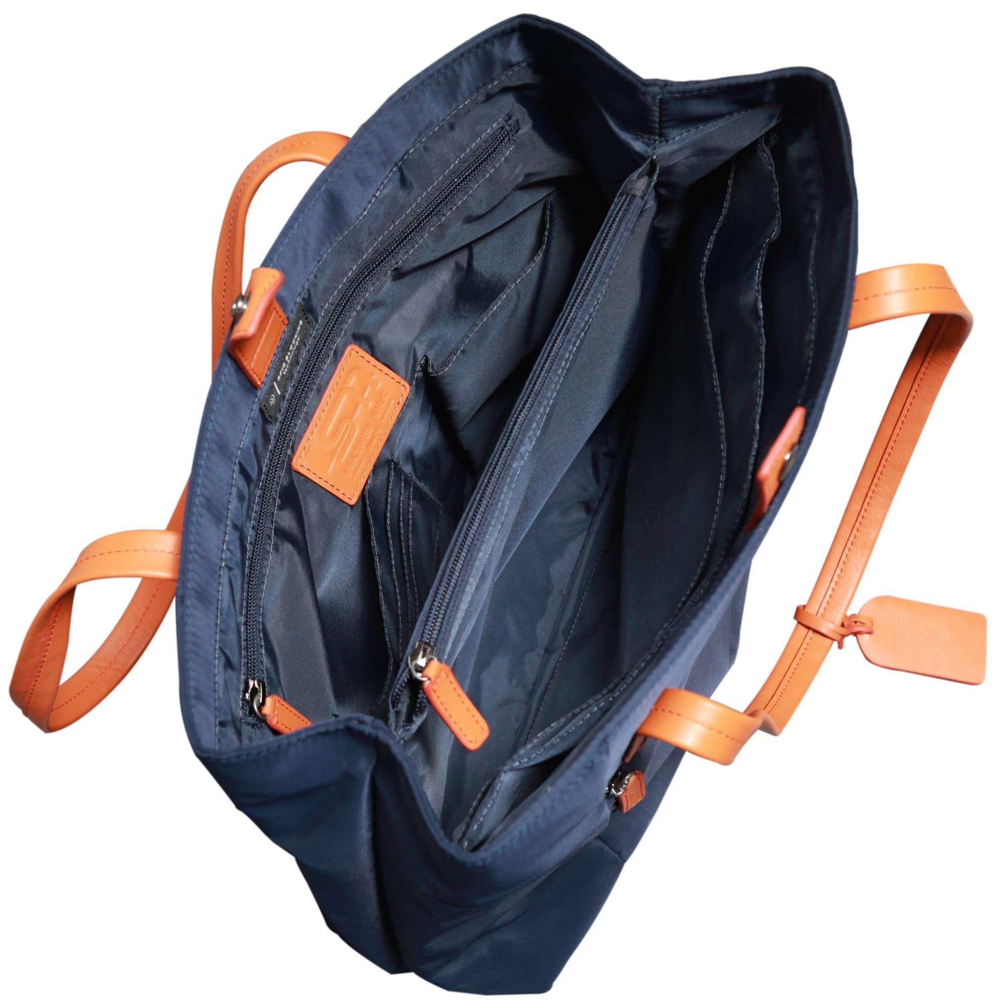 Interior view of organized laptop tote bag with padded sleeve and compartments