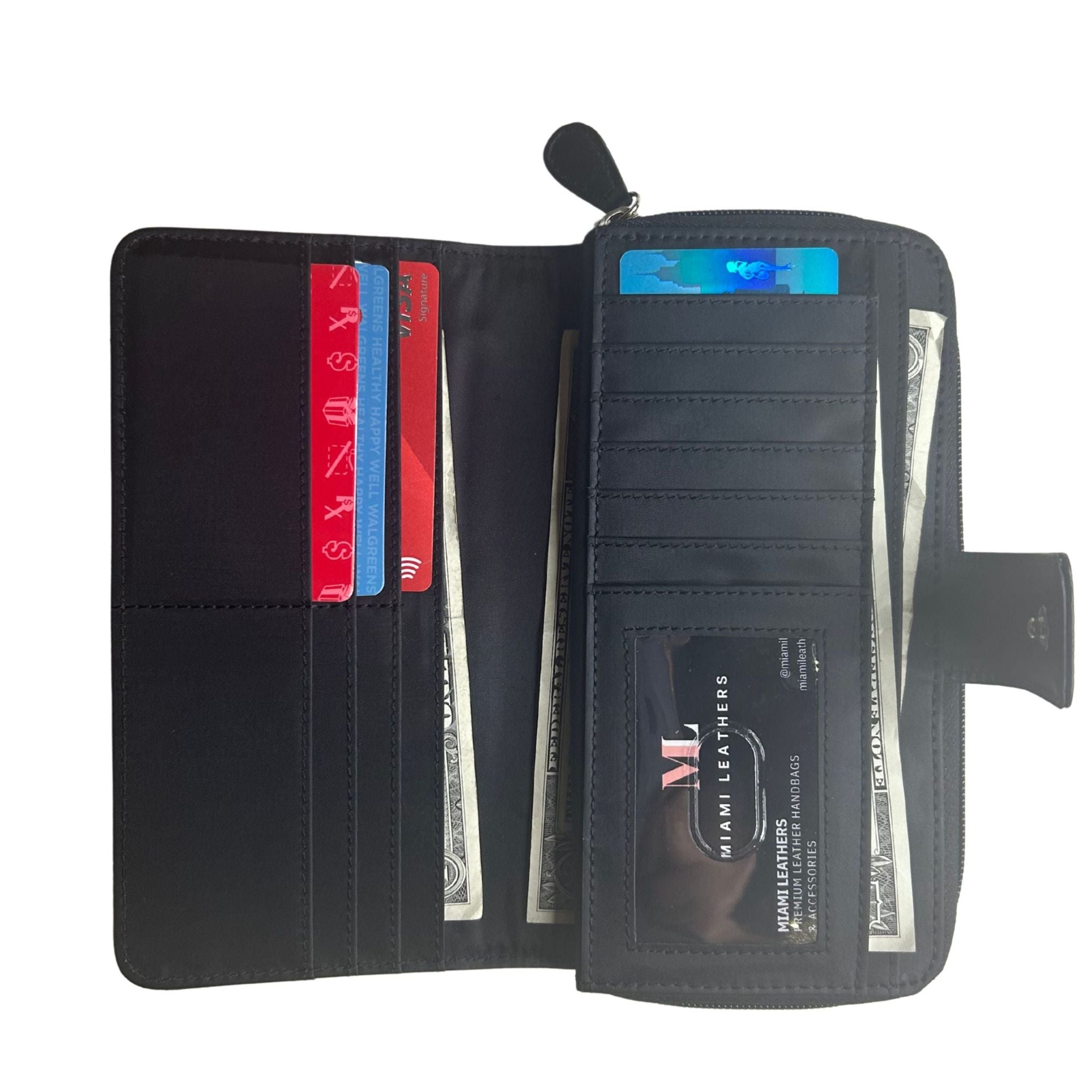 An open black lambskin zip-around wallet shown flat, displaying multiple card slots filled with sample cards, cash compartments, and a clear ID window holding a business card.
