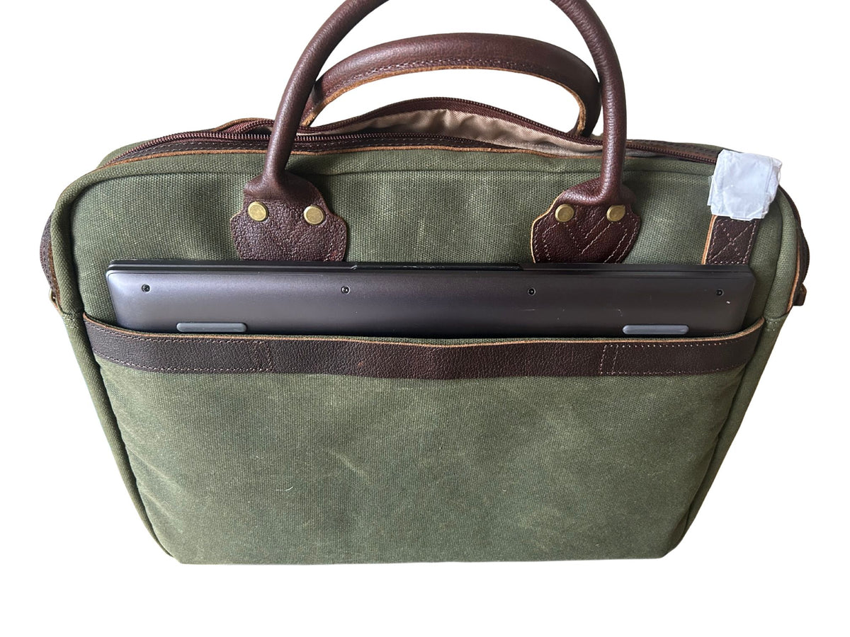 Maxwell waxed canvas messenger bag back slip pocket holding a 16-inch laptop