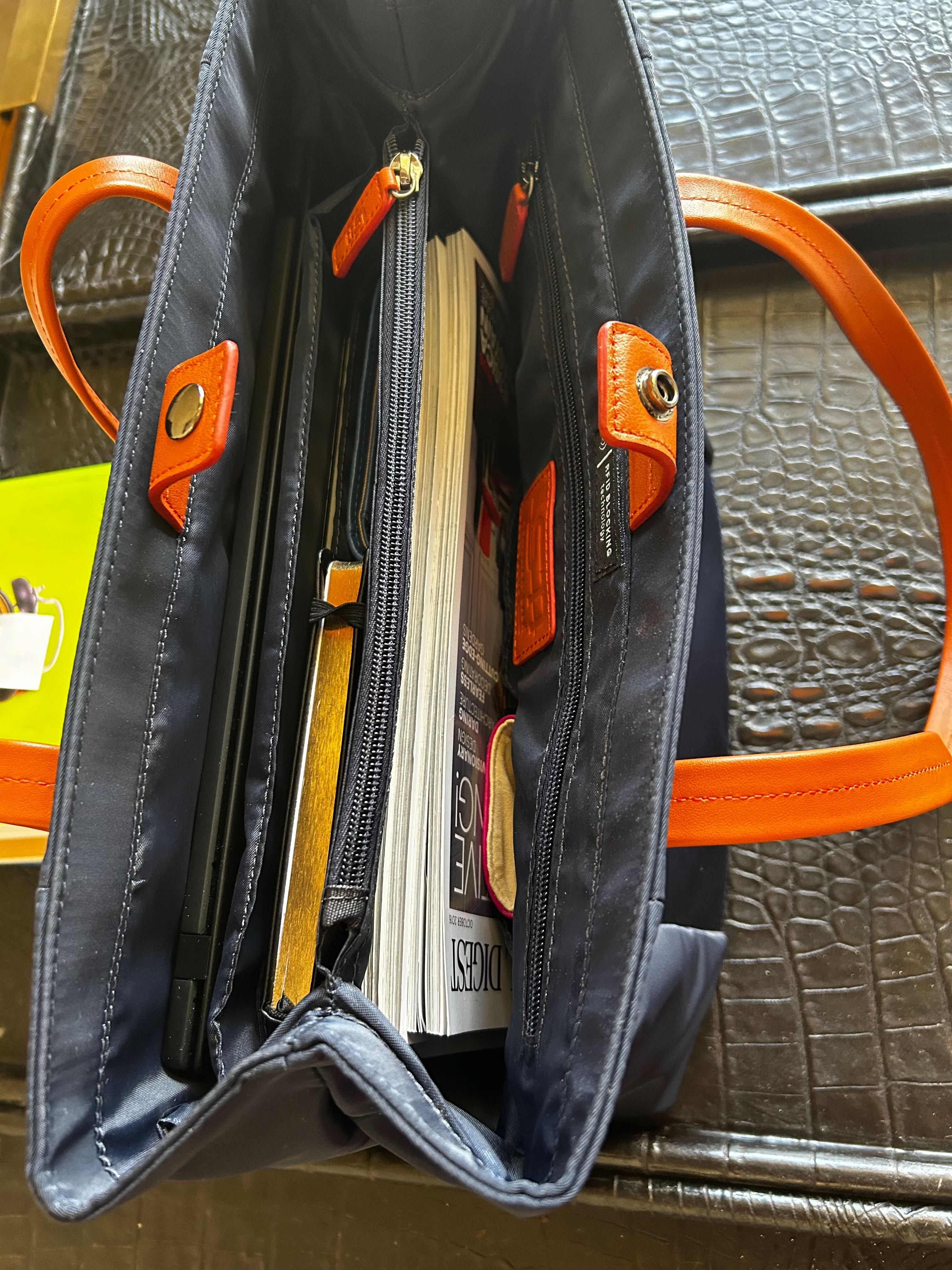 Organized work tote bag with divided compartments for laptop documents and essentials