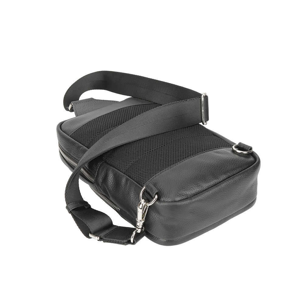 Black leather bag with a shoulder strap on a white background