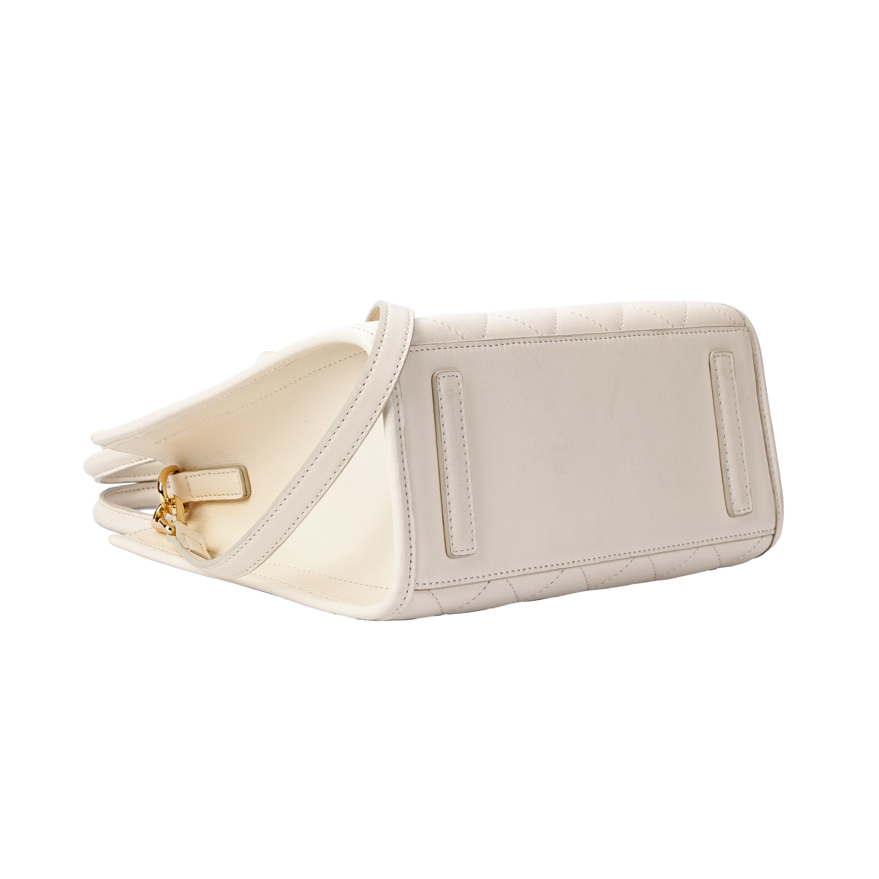 Bottom view of structured white quilted leather tote handbag